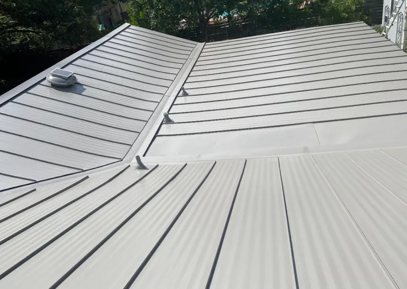 Solar attic fan installed on a metal roof for Roof Ventilation in Melbourne